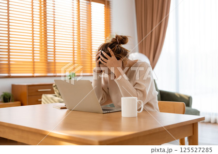 Office syndrome. Overworked tired young asian woman feeling headache 125527285