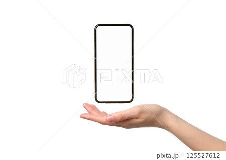 A smartphone hovers above an open hand demonstrating a sleek design, isolated on white A smartphone hovers above an open hand demonstrating a sleek design, isolated on white 125527612