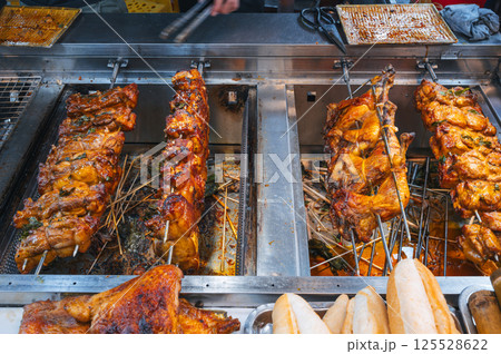 Grilled chicken is cooked at street food night market 125528622