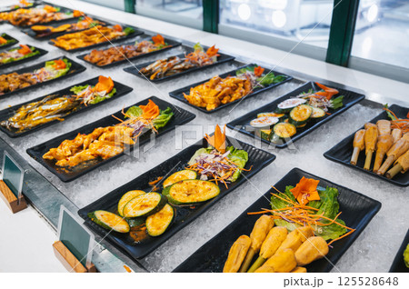 Asian buffet in hotel in Asia. Vietnamese food and dishes at the self-service restaurant for breakfast 125528648