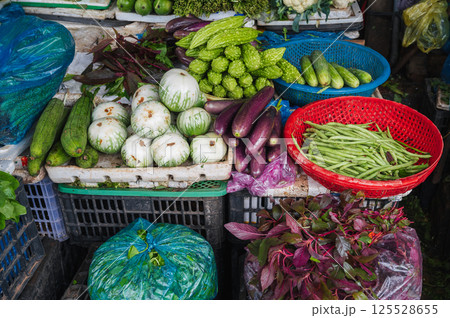 assortment of various vegetables at street grocery and vegetable market in Asia in Vietnam assortment of various vegetables at street grocery and vegetable market in Asia in Vietnam 125528655
