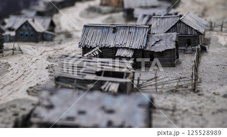 Miniature model of old wooden village showing rural life in pre-industrial Russia 125528989