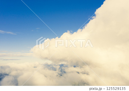 Aerial view white clouds in blue sky. View from drone. Aerial top view cloudscape texture. Texture of clouds. View from above. Panorama clouds background Aerial view white clouds in blue sky. View from drone. Aerial top view cloudscape texture. Texture of clouds. View from above. Panorama clouds background 125529135