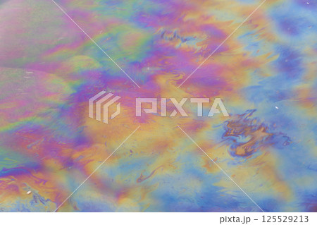 Oil petrol water pollution. Ecological disaster. Slick industry oil fuel spilling water pollution. Water with patches of gasoline and oil. Ecological catastrophy.  Concept of environmental problems 125529213