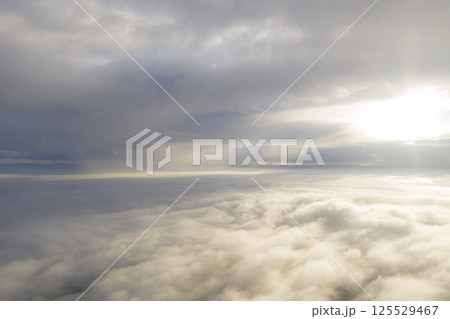 Aerial view white clouds in blue sky. View from drone. Aerial view cloudscape texture background. Texture of clouds. View from above. Panorama clouds background Aerial view white clouds in blue sky. View from drone. Aerial view cloudscape texture background. Texture of clouds. View from above. Panorama clouds background 125529467