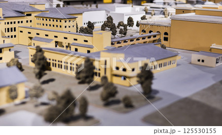 Architectural scale model showing residential buildings, streets and trees 125530155