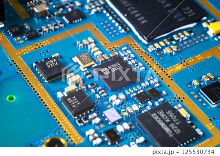 Macro shot of Circuit board with resistors microchips and electronic components. Computer hardware technology. Integrated communication processor. Information engineering. Semiconductor. PCB. Closeup 125530734