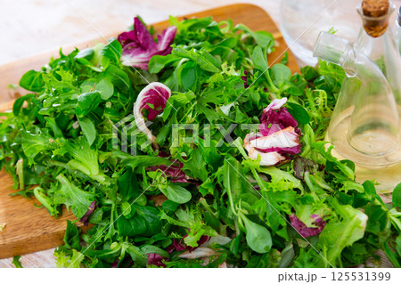 Fresh leaves of endive radicchio and field salad Fresh leaves of endive radicchio and field salad 125531399
