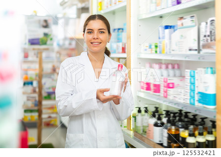 Pharmacist showing skin care prouct 125532421