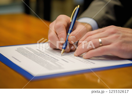 Professional Business Agreement Signed with Pen on a Table in a Corporate Setting 125532617