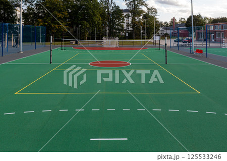 New multi-sport court opened at local park featuring basketball and tennis facilities 125533246