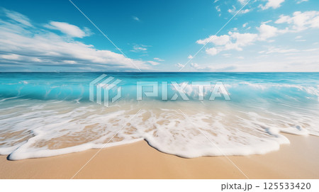 Crystal-clear turquoise wave rolling onto a sandy beach under a bright blue sky with soft white clouds Crystal-clear turquoise wave rolling onto a sandy beach under a bright blue sky with soft white clouds 125533420