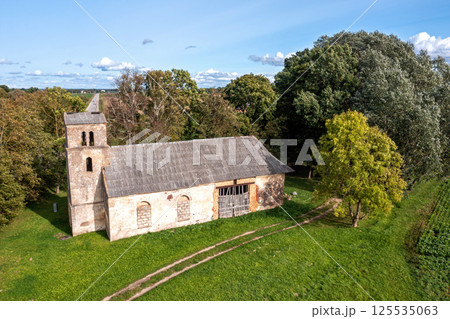 An old abandoned stone church in the countryside An old abandoned stone church in the countryside 125535063