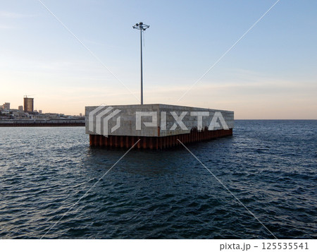 Concrete pier at sea. Concrete pier at sea. 125535541