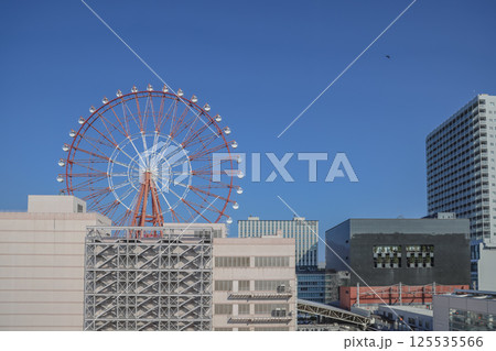 March 23 2025 A Modern Urban Cityscape Featuring Ferris Wheel, Japan 125535566
