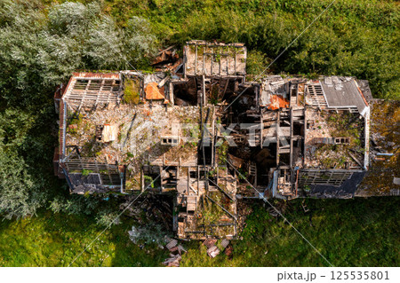 Ruins of a destroyed house in the village. View from above. Ruins of a destroyed house in the village. View from above. 125535801
