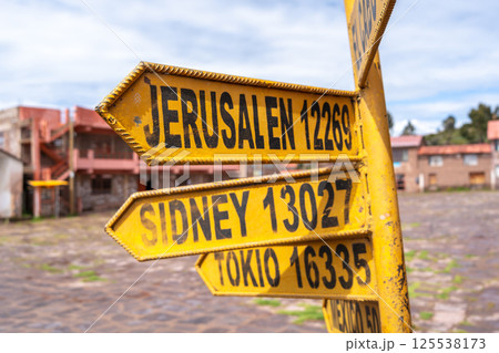 World capitals distance sign on Taquile Island, Lake Titicaca, Peru 125538173