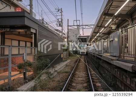 Urban Railway Crossing During Twlight with Train and Buildings, Tokyo Dec 8 2024 125539294
