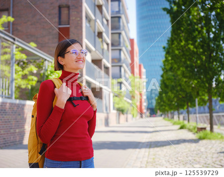 Tourist woman explores modern Frankfurt, 125539729