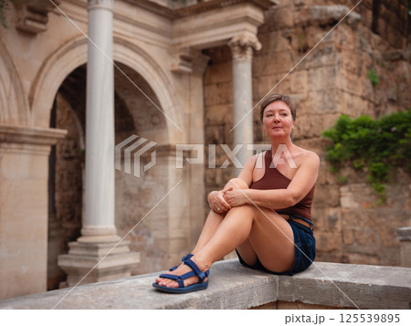 Woman walking narrow streets of old town Antalya Turkey Woman walking narrow streets of old town Antalya Turkey 125539895
