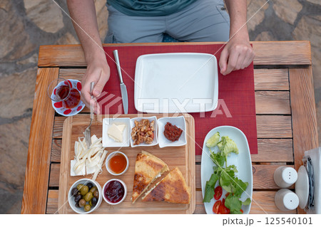 Traditional Turkish breakfast in garden near home 125540101