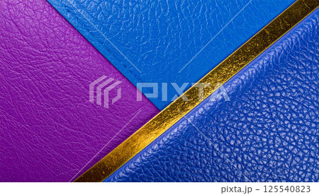 Vibrant blue and violet leather textured surfaces create modern luxury background, enhanced by shiny gold accent that adds elegance and sophistication Vibrant blue and violet leather textured surfaces create modern luxury background, enhanced by shiny gold accent that adds elegance and sophistication 125540823