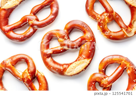 Pretzel or Bretzel, traditional German beer snack, a wheat bread with salt Pretzel or Bretzel, traditional German beer snack, a wheat bread with salt 125541701