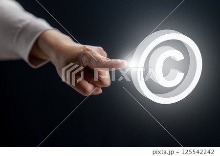 Businesswoman touching the icon of the copyright logo. Technology innovation on a virtual screen. Concept of digital copyright and patent, intellectual assets and property, legal protection Businesswoman touching the icon of the copyright logo. Technology innovation on a virtual screen. Concept of digital copyright and patent, intellectual assets and property, legal protection 125542242