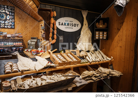 Traditional Norwegian Shop with Dried Fish Display at Sakrisoy, Lofoten, Norway. Traditional Norwegian Shop with Dried Fish Display at Sakrisoy, Lofoten, Norway. 125542366