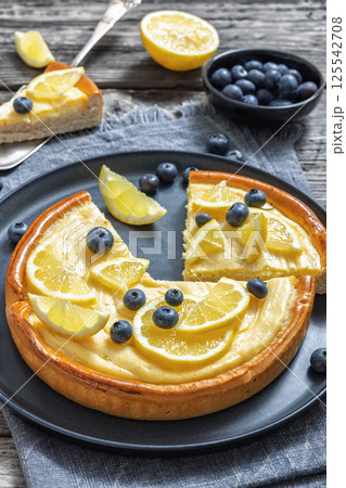 Cheesecake with blueberries sliced on a plate 125542708