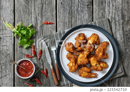 crispy fried chicken wings on a plate crispy fried chicken wings on a plate 125542710