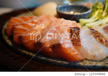 Exquisite Sashimi Platter with Fresh Salmon and Seafood Presentation Exquisite Sashimi Platter with Fresh Salmon and Seafood Presentation 125544666