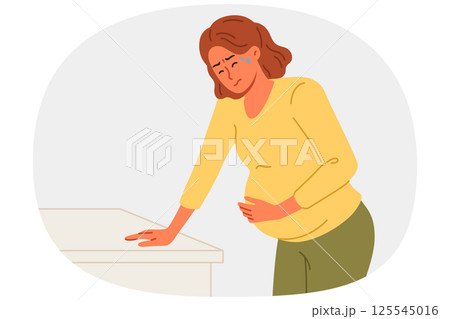 Pregnant woman holds stomach, for concept complications caused by fetal development disorders Pregnant woman holds stomach, for concept complications caused by fetal development disorders 125545016
