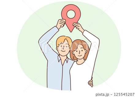 Man and woman stand in embrace and show large geotag to share coordinates for house party 125545207