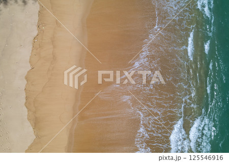 Top view beach beautiful sea nature background,Amazing waves sand sea background 125546916