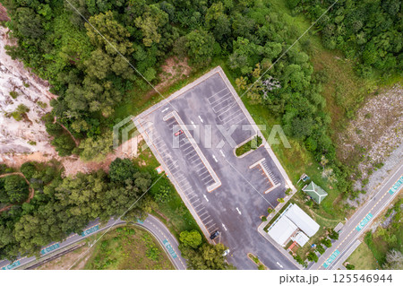 Aerial view drone shot of parking lot outdoors vehicles in the park Aerial view drone shot of parking lot outdoors vehicles in the park 125546944