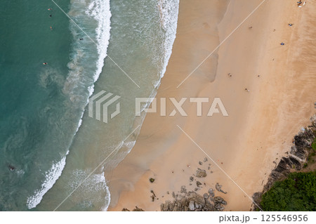 Top view beach beautiful sea nature background,Amazing waves sand sea background Top view beach beautiful sea nature background,Amazing waves sand sea background 125546956