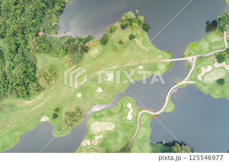 Aerial view of beautiful green golf field fairway and putting green, Top down image for sport background and travel nature background, Amazing green nature view 125546977