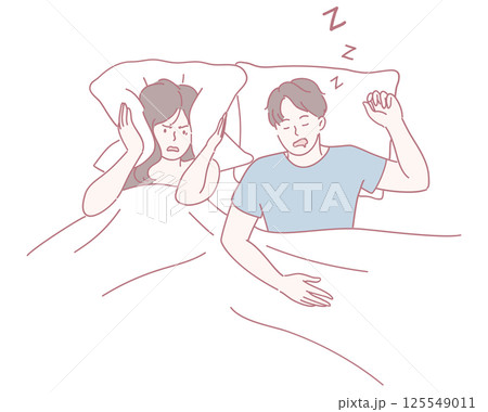 A couple in bed faces the humorous yet frustrating issue of snoring disruptions at night 125549011