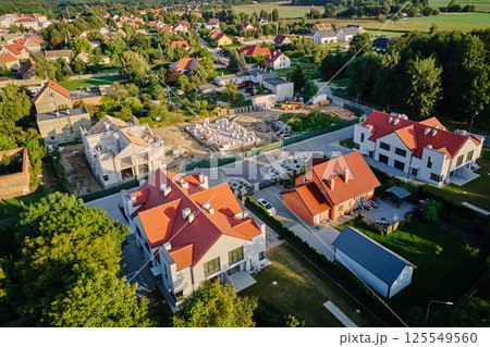 Aerial view of residential area with houses under construction Aerial view of residential area with houses under construction 125549560