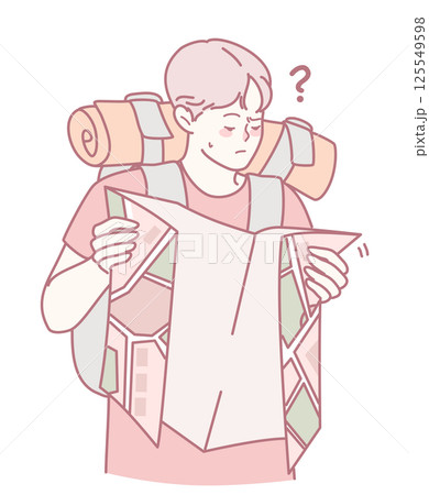 A lost hiker is intently checking their map while wearing a fully packed backpack 125549598