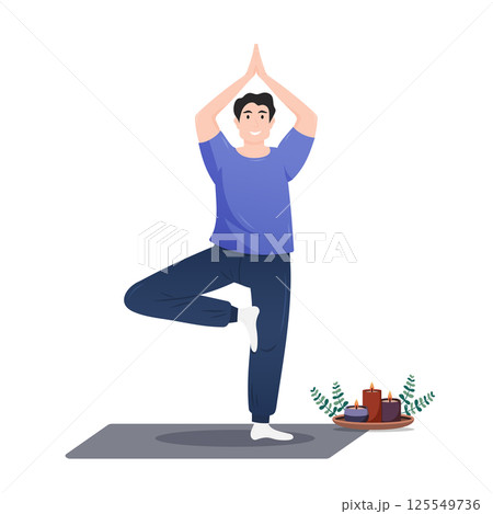 Young man practicing yoga in a serene indoor setting with candles 125549736