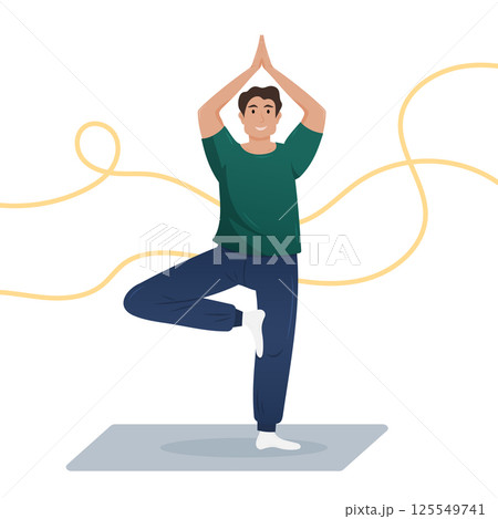A man stands on one leg in a yoga pose, creating a peaceful ambiance. 125549741