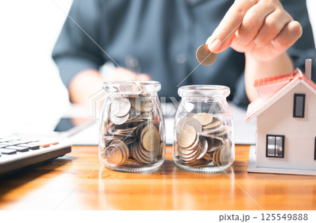 Investing in a home requires careful financial planning, including obtaining a mortgage loan and managing credit, as it signifies a significant business investment of money into a house. Investing in a home requires careful financial planning, including obtaining a mortgage loan and managing credit, as it signifies a significant business investment of money into a house. 125549888