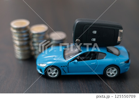 Business concept involved using finance calculator to determine premium for vehicle policy, ensuring clear financial contract for car. Investing in auto insurance can save money on transport costs. Business concept involved using finance calculator to determine premium for vehicle policy, ensuring clear financial contract for car. Investing in auto insurance can save money on transport costs. 125550709
