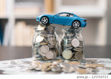 Business concept involved using finance calculator to determine premium for vehicle policy, ensuring clear financial contract for car. Investing in auto insurance can save money on transport costs. Business concept involved using finance calculator to determine premium for vehicle policy, ensuring clear financial contract for car. Investing in auto insurance can save money on transport costs. 125550721