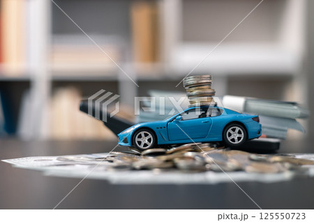 Business concept involved using finance calculator to determine premium for vehicle policy, ensuring clear financial contract for car. Investing in auto insurance can save money on transport costs. Business concept involved using finance calculator to determine premium for vehicle policy, ensuring clear financial contract for car. Investing in auto insurance can save money on transport costs. 125550723
