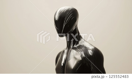 Man in a black suit with a silver head. The suit is made of metal. The man is standing in front of a white wall 125552483