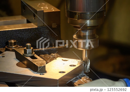 The metal working operation on NC milling machine. 125552692