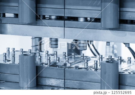 The metal forming process by progressive die in the light blue scene. The metal forming process by progressive die in the light blue scene. 125552695